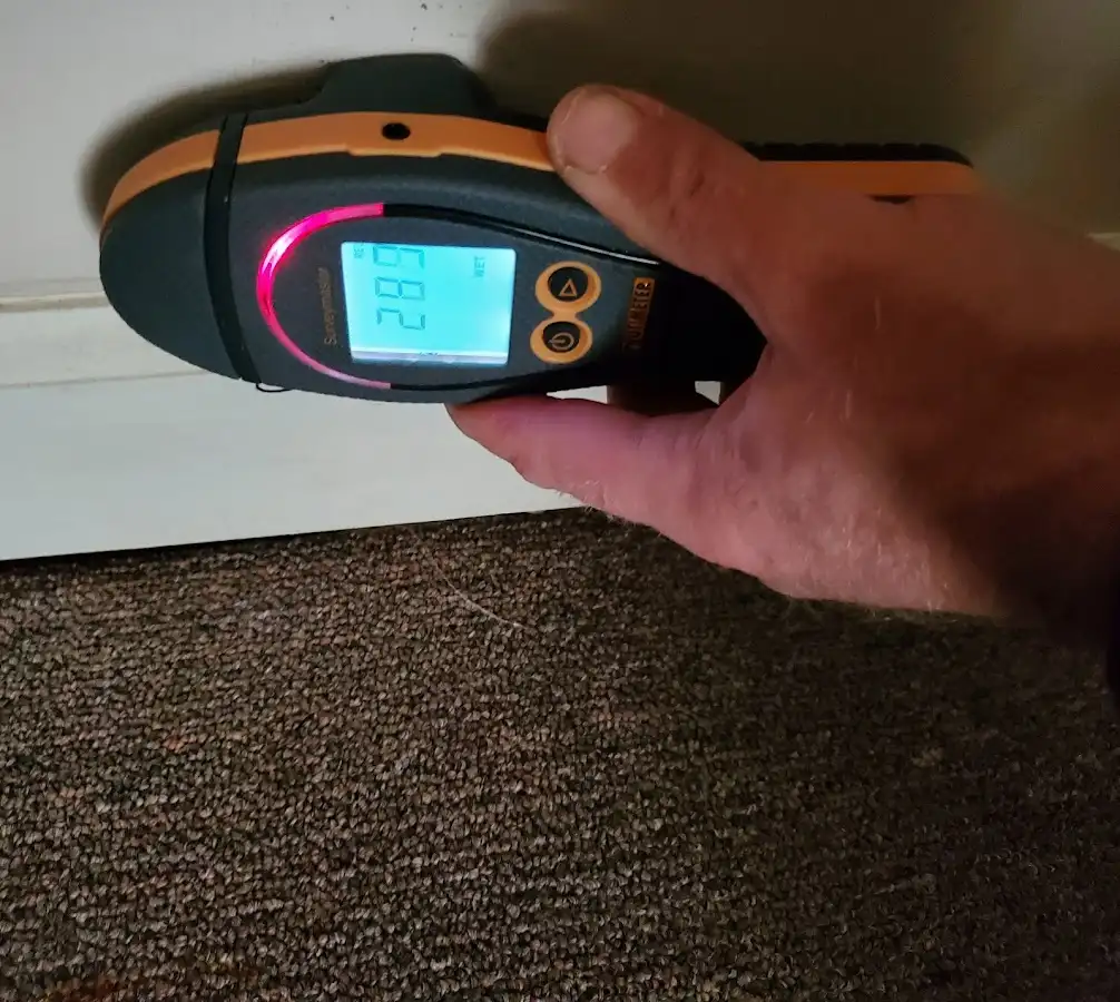 Moisture detection at baseboard during Storm Damage Restoration in North Middleton